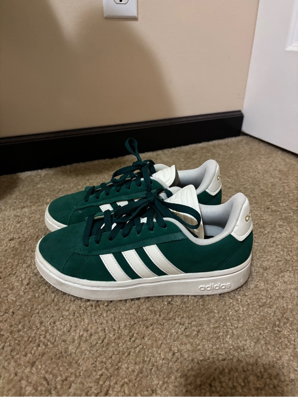 Adidas women’s Green Suede Sneakers with White Stripes with cloud foam soles.